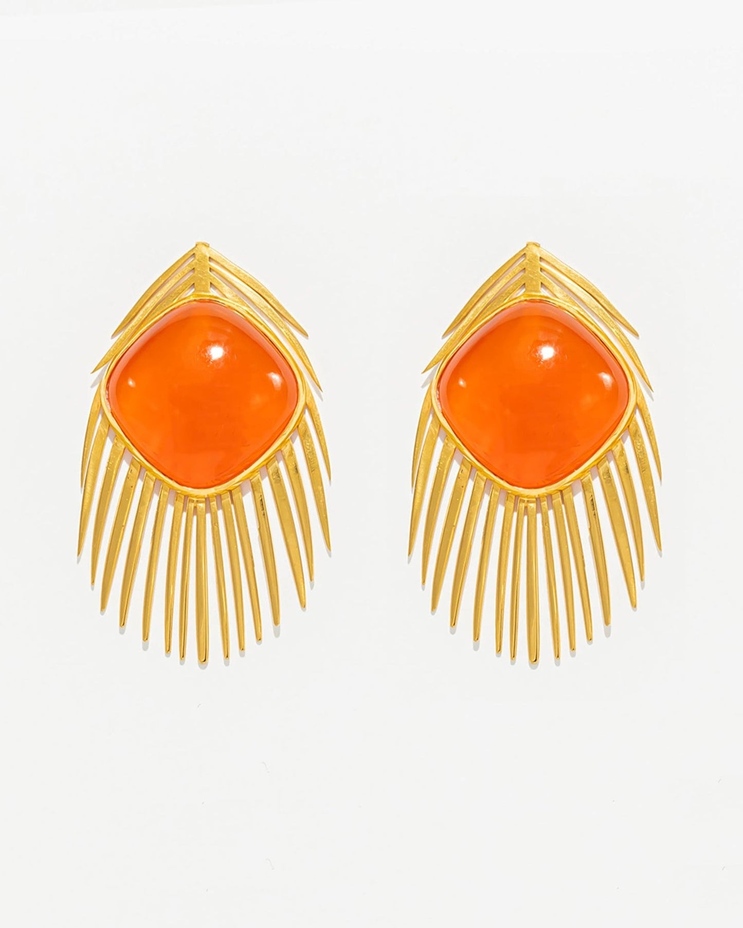 Brincos Pena de Pavão com Cornalina